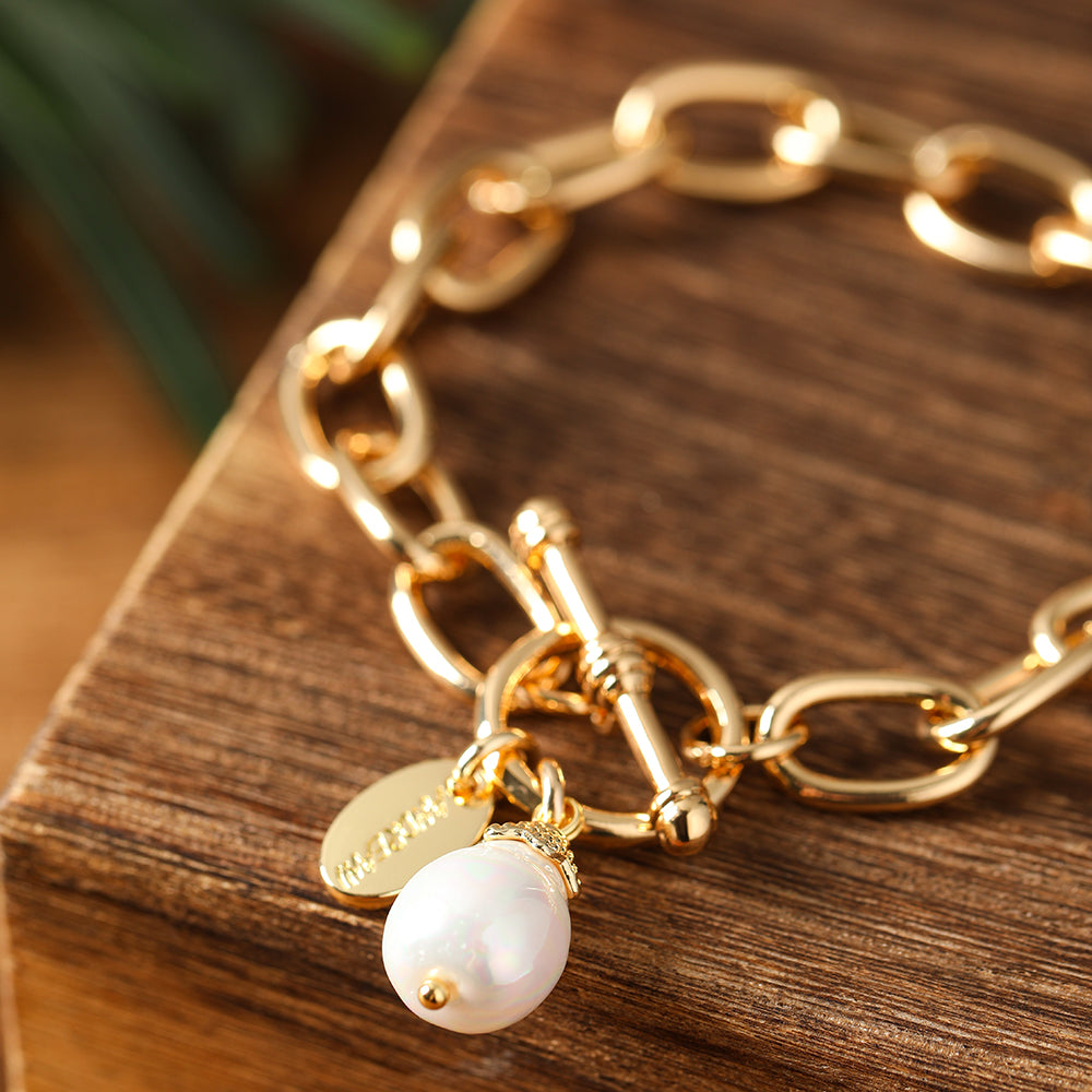 Gliederarmband mit echter Shellbead aus Muschelkern golfarbig